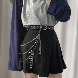 Punk style pleated black mini skirt with layered metal star chains and belt accessory