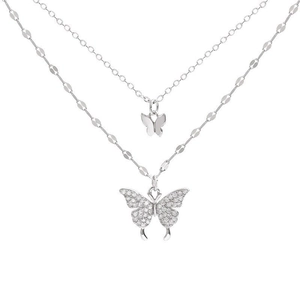 Double-layered silver butterfly necklace with sparkling zircon pendants on a white background