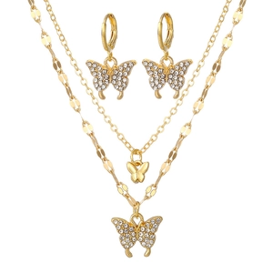 Parure papillon double couche avec collier doré et boucles d'oreilles ornées de strass brillants