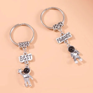 Minimalist silver astronaut Best Friends keychain set with engraved metal charms