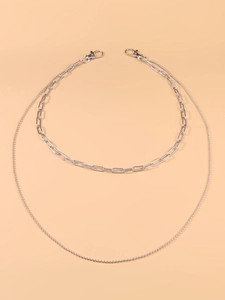 Detail view of double-layered silver punk waist chain with bead and paperclip links