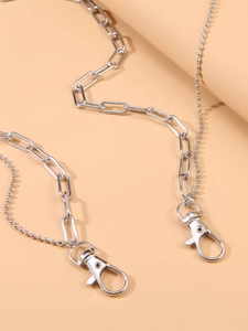 Detail of silver double-layered waist chain with bead links and lobster clasps