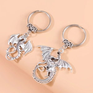 Vintage silver flying dragon metal keychain pendants with detailed scale textures