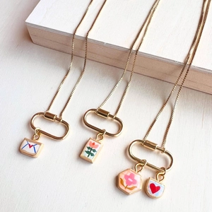 18K gold plated stainless steel necklace with tulip and heart enamel charms and carabiner