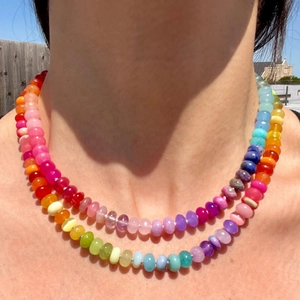 Colorful beaded double-layer stainless steel necklace on model in outdoor natural light