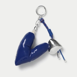 Macro shot of a navy puffer heart keychain with braided rope and silver lobster clasp