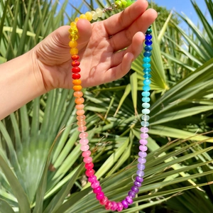 Colorful beaded necklace featuring rainbow beads and gold lobster clasp detail