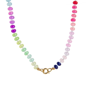 Detailed macro view of vibrant rainbow gradient beaded necklace with golden clasp