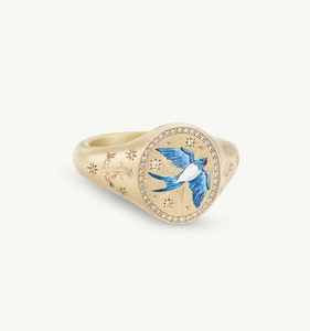 Close-up of nautical signet ring with blue enamel swallow and anchor engravings
