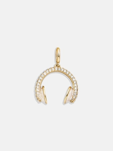 Macro view of headphone jewelry pendant in 18K gold plating with cubic zirconia pavé