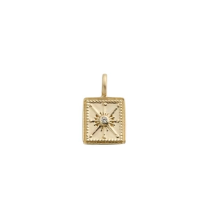 Close-up of gold rectangular starburst pendant with crystal inlay and beaded edge detail