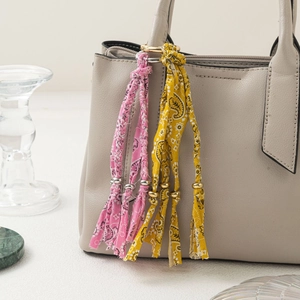 Handmade bohemian paisley fabric keychain charms with gold and silver bead accents