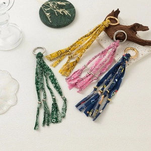 Handmade woven colorful fabric keychain set with metal rings and decorative beads
