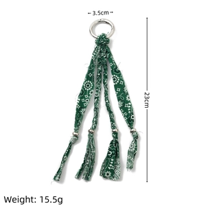 Handmade green paisley fabric keychain with 23cm length and silver ring connector
