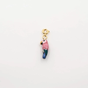 Detailed macro view of a colorful parrot pendant with a 18K gold plated spring clasp