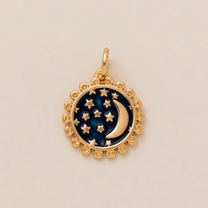 Detailed close-up of golden celestial pendant with dark blue enamel moon and stars