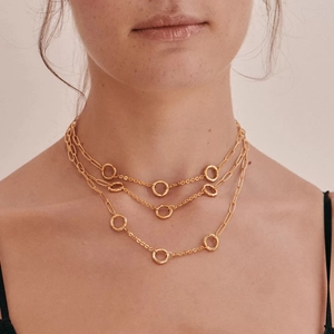 Close-up of triple-layered 18K gold-plated paperclip and link chain necklace set