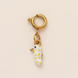 Golden hoop earring with a white and yellow enamel seahorse pendant animal charm