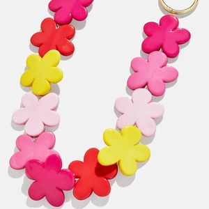 Detail of colorful matte flower bead chain with golden metal spring ring clasp