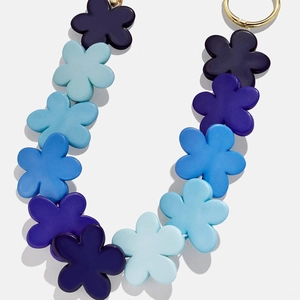 Detail of matte blue gradient flower bead chain with premium gold round metal buckle
