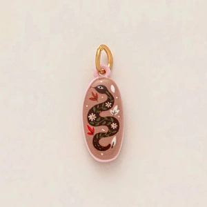 Detail showing hand-painted oval snake pendant with floral motifs and 14K gold-plated ring