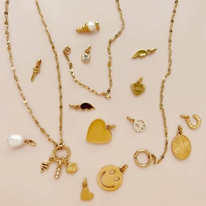 Golden stainless steel sun pendant and 18K gold plated charms with zircon and pearls