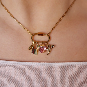 18K gold plated necklace featuring Cupid pendant and pink heart charm on carabiner link