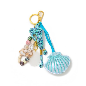 Detail of nautical bag charm with iridescent shell pendant and colorful bead strings
