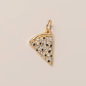 Detailed view of pizza pendant with sparkling white and black cubic zirconia stones