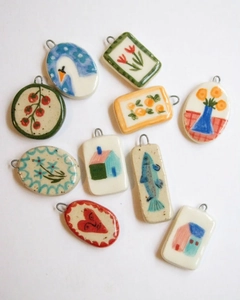 Collection of 10 assorted 18K gold plated copper strawberry and naive art enamel pendants