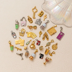 Collection of assorted 18K gold plated stainless steel heart and fashion charms