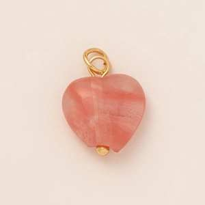 Detail of pink heart-shaped crystal stone pendant with 18K gold plated metal components
