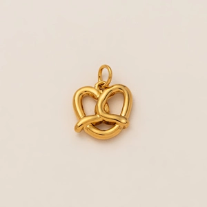 Detailed view of an 18K gold plated pretzel pendant with polished knotted metal texture