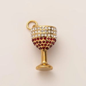 Detailed close-up of 18K gold plated wine glass pendant with red and white crystal inlay