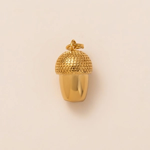 Detailed view of acorn pendant with 18K gold plating and realistic scale texture