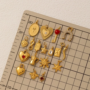 Golden stainless steel charm pendants featuring moon star and heart shapes for DIY necklaces