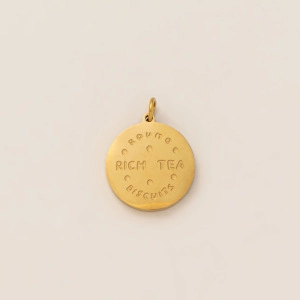 Detailed view of round 18K gold plated Rich Tea biscuit pendant for DIY jewelry
