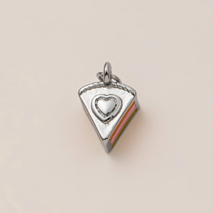 Detail view of 18K gold plated stainless steel cake charm with heart and rainbow enamel