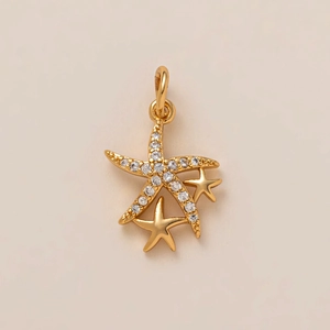 Golden starfish pendant set with white diamonds on a warm minimalist background