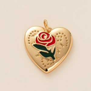 Golden heart pendant with red rose enamel detail and gold tone link chain necklace