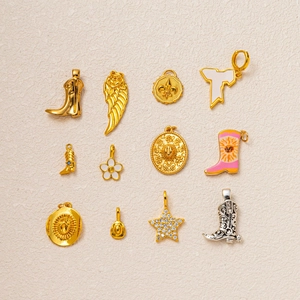 Macro detail of western-style cowboy boot and star pendants for DIY jewelry making