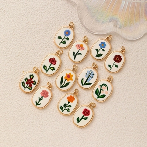 Lot de 12 pendentifs floraux ovales avec bords dorés pour la création de bijoux
