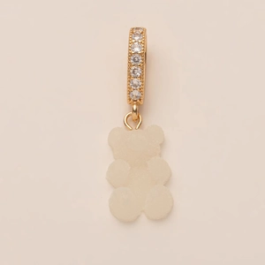Close-up of a gold-plated bear charm with matte finish and zircon-set bail pendant
