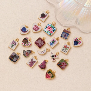 Floral print jewelry pendants featuring cats and moon shapes for DIY crafting designs