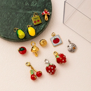 Colorful fruit pendants collection including strawberry and cherry charms in 18K gold finish