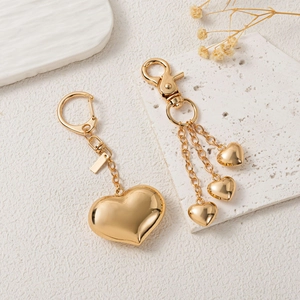 Golden heart keychain pendant with mirror finish and spring snap hook for bags