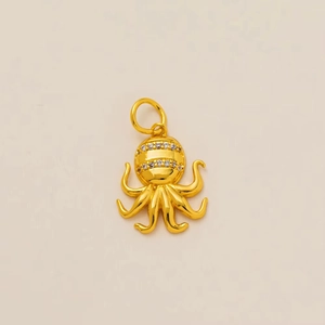 Detailed macro view of an octopus pendant with white crystals and gold plating