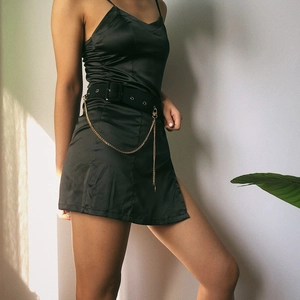 Satin black mini dress with adjustable waist belt and stylish gold hip chain decoration
