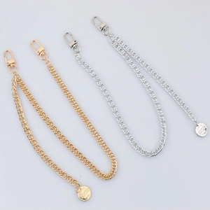 Hip hop style metal trouser chain in gold and silver finish with lobster clasp and round tag