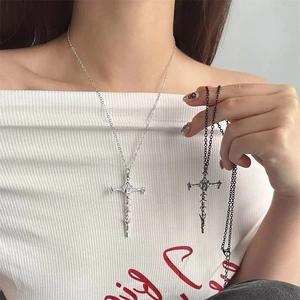 Detailed view of gothic cross pendants in bright silver and matte black on O-chain